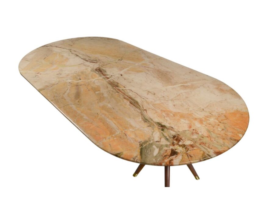 "Stylish oval dining table with a marble top in beige, orange, and green, supported by wooden legs with brass accents."